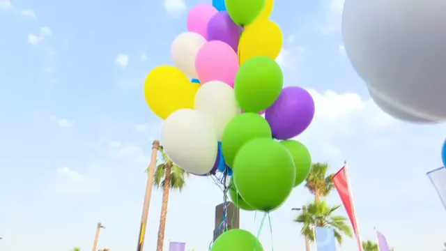 Balloons in the mark’s colours against the sky