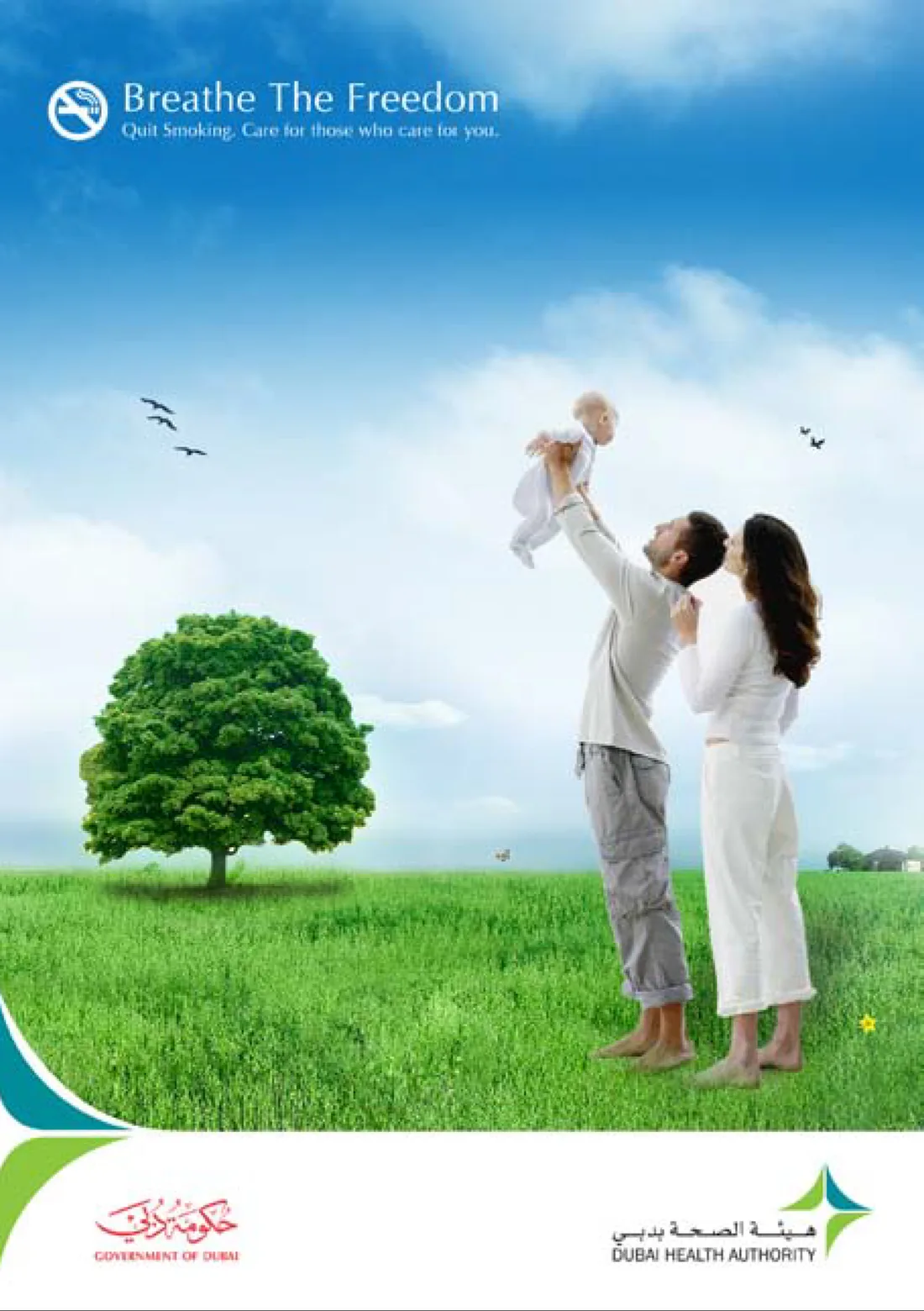 Breathe The Freedom: a couple lift a baby under an open sky